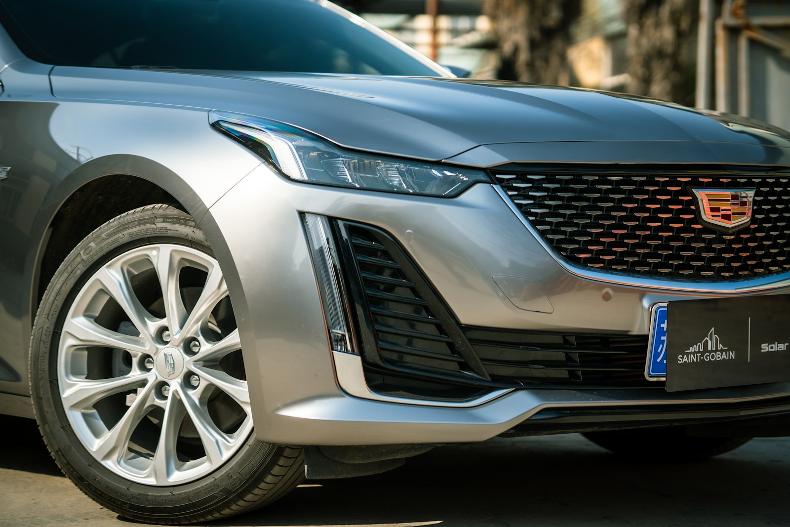 a silver car parked on the side of the road